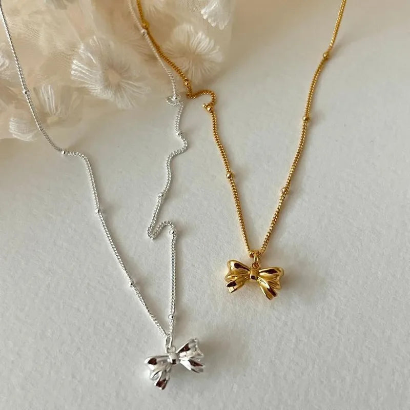 Sterling Silver Bow Pendant Necklace in Silver or Gold